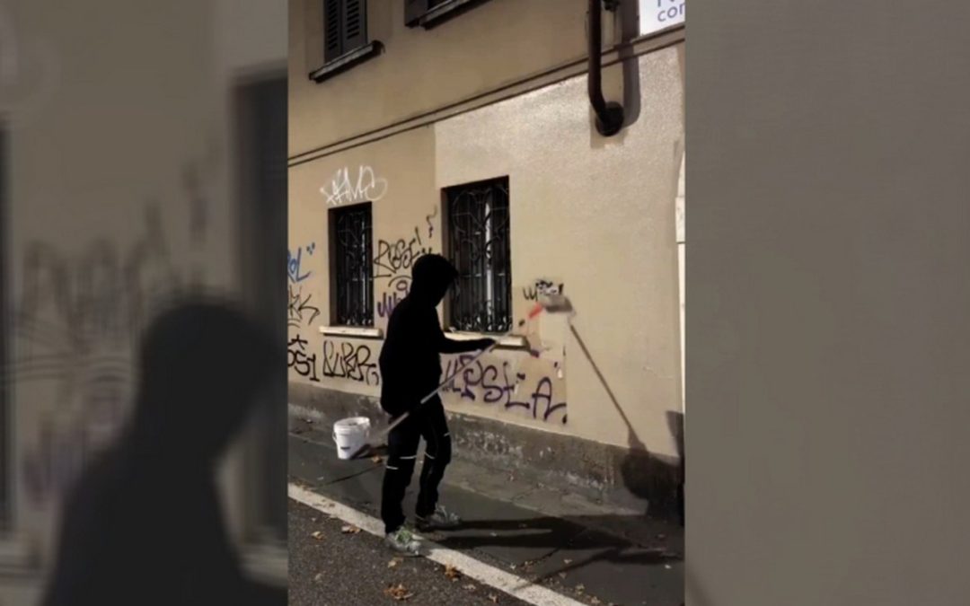 Masked Hero Goes Viral for Painting Over Graffiti on Buildings in Northern Italy – WATCH